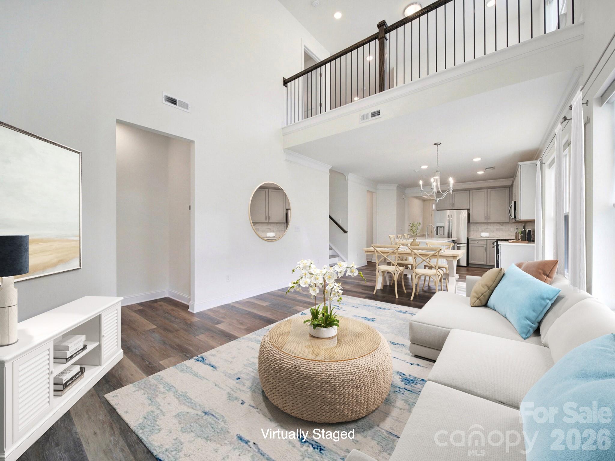 4003 Rothwood Lane Harrisburg, NC 28075 - Photo 4 of 30 a living room with furniture kitchen view and a wooden floor