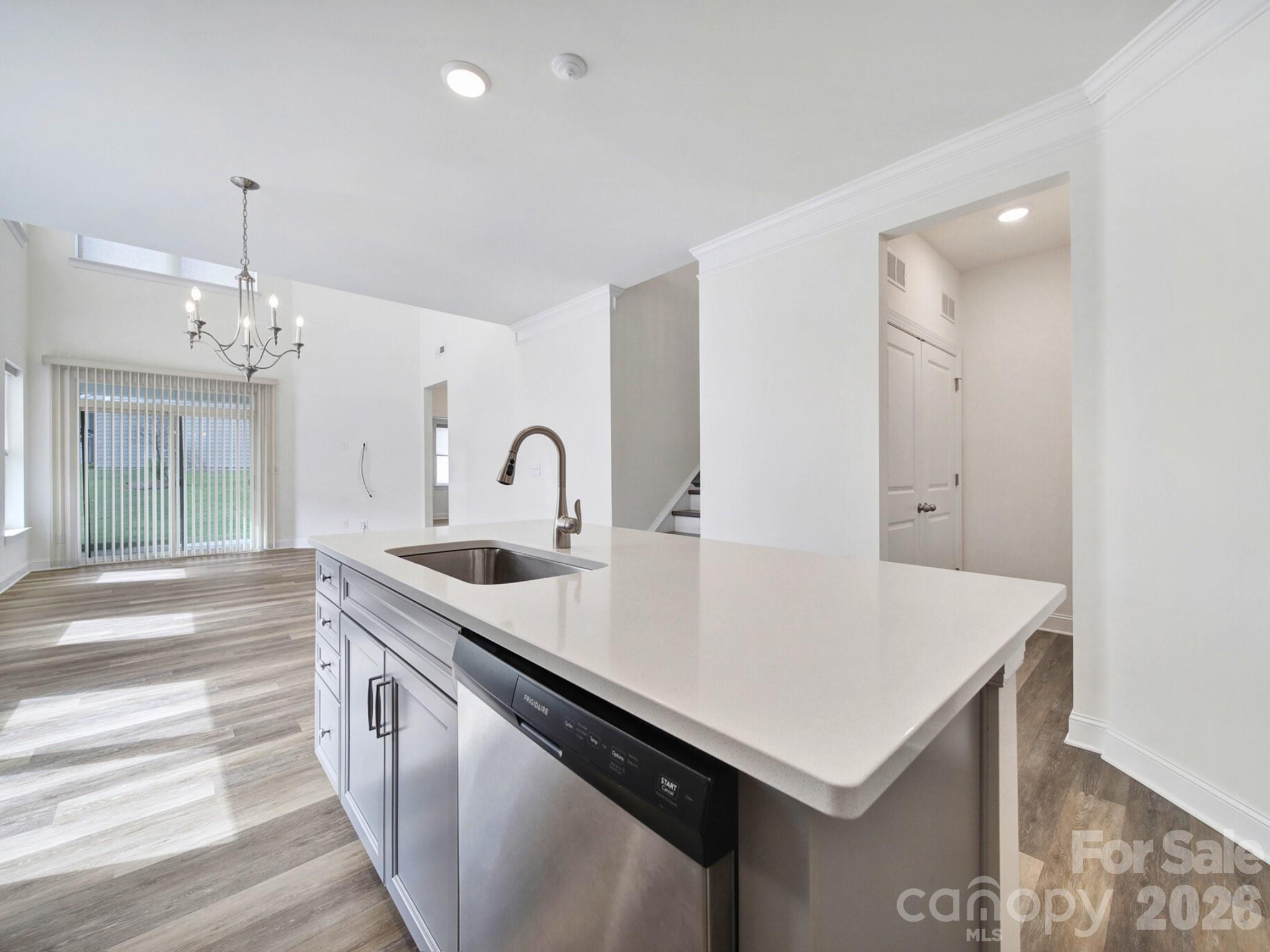 4003 Rothwood Lane Harrisburg, NC 28075 - Photo 8 of 30 a kitchen that has a sink a stove and a table