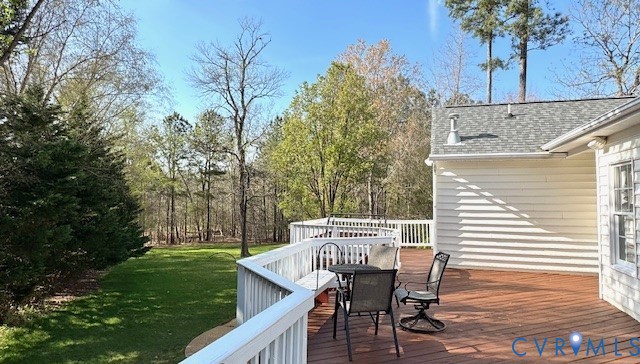 14307 Abbots Ridge Court Midlothian, VA 23113 - Photo 9 of 16 a view of a patio with table and chairs with wooden fence and plants