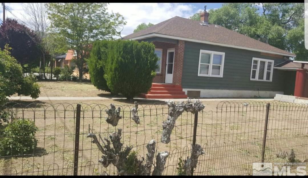 1285 East 9th Street Reno, NV 89512 - Photo 3 of 13 a front view of a house with a garden