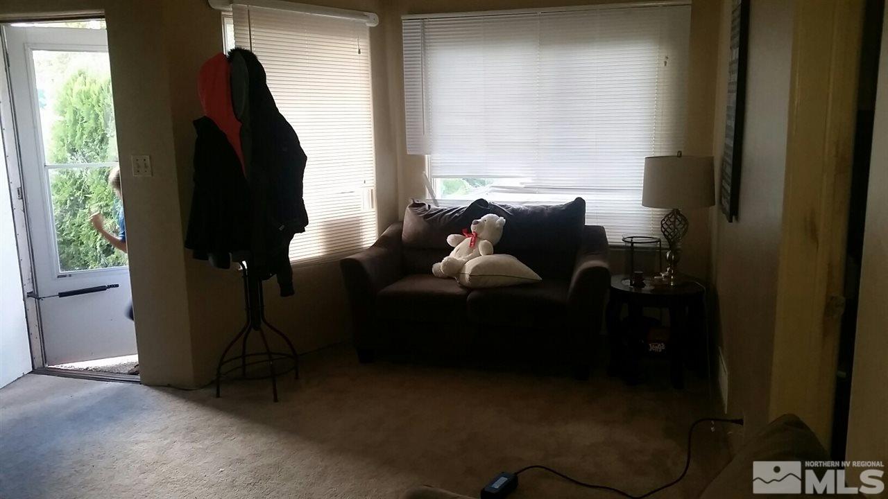 1285 East 9th Street Reno, NV 89512 - Photo 6 of 13 a living room with furniture and a window