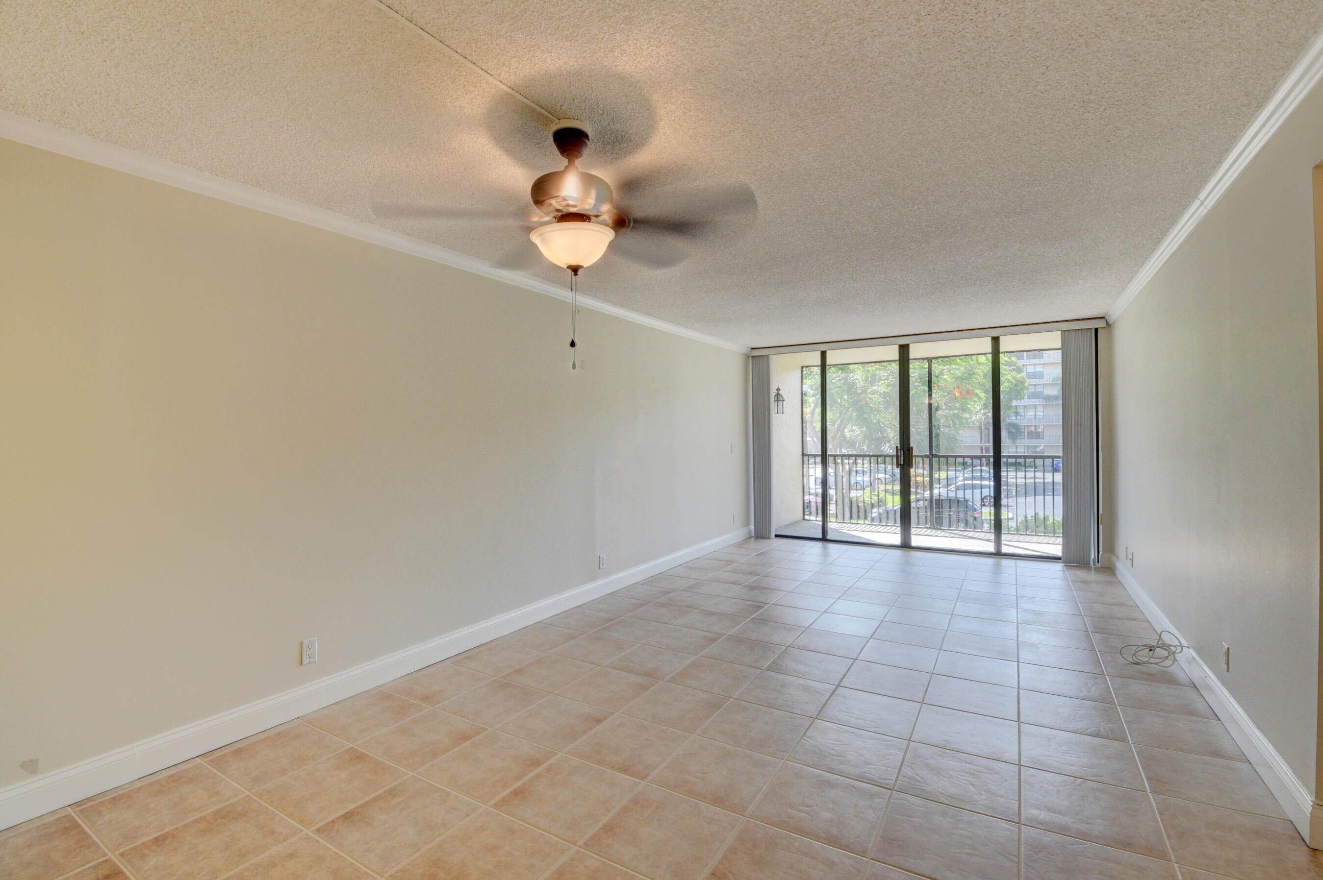 16 Royal Palm Way, Unit 202 Boca Raton, FL 33432 - Photo 13 of 54 wooden floor in an empty room with a window