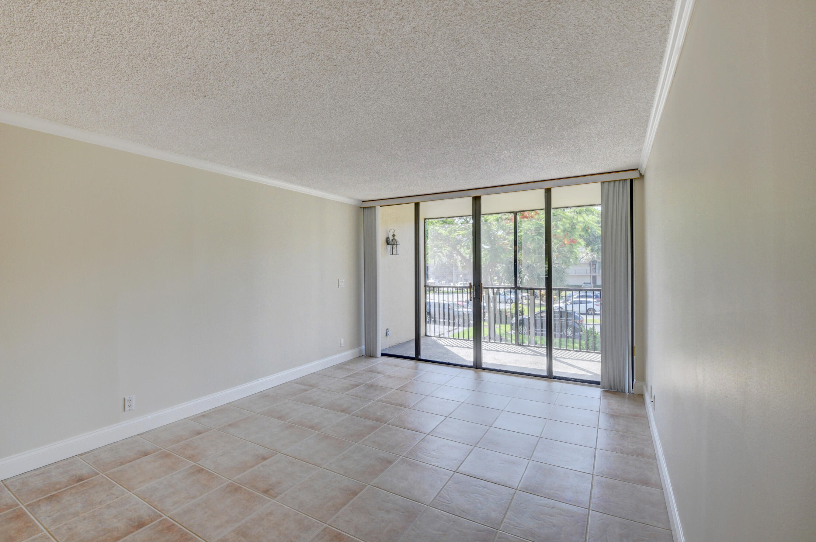 16 Royal Palm Way, Unit 202 Boca Raton, FL 33432 - Photo 17 of 54 a view of an empty room with a sliding door