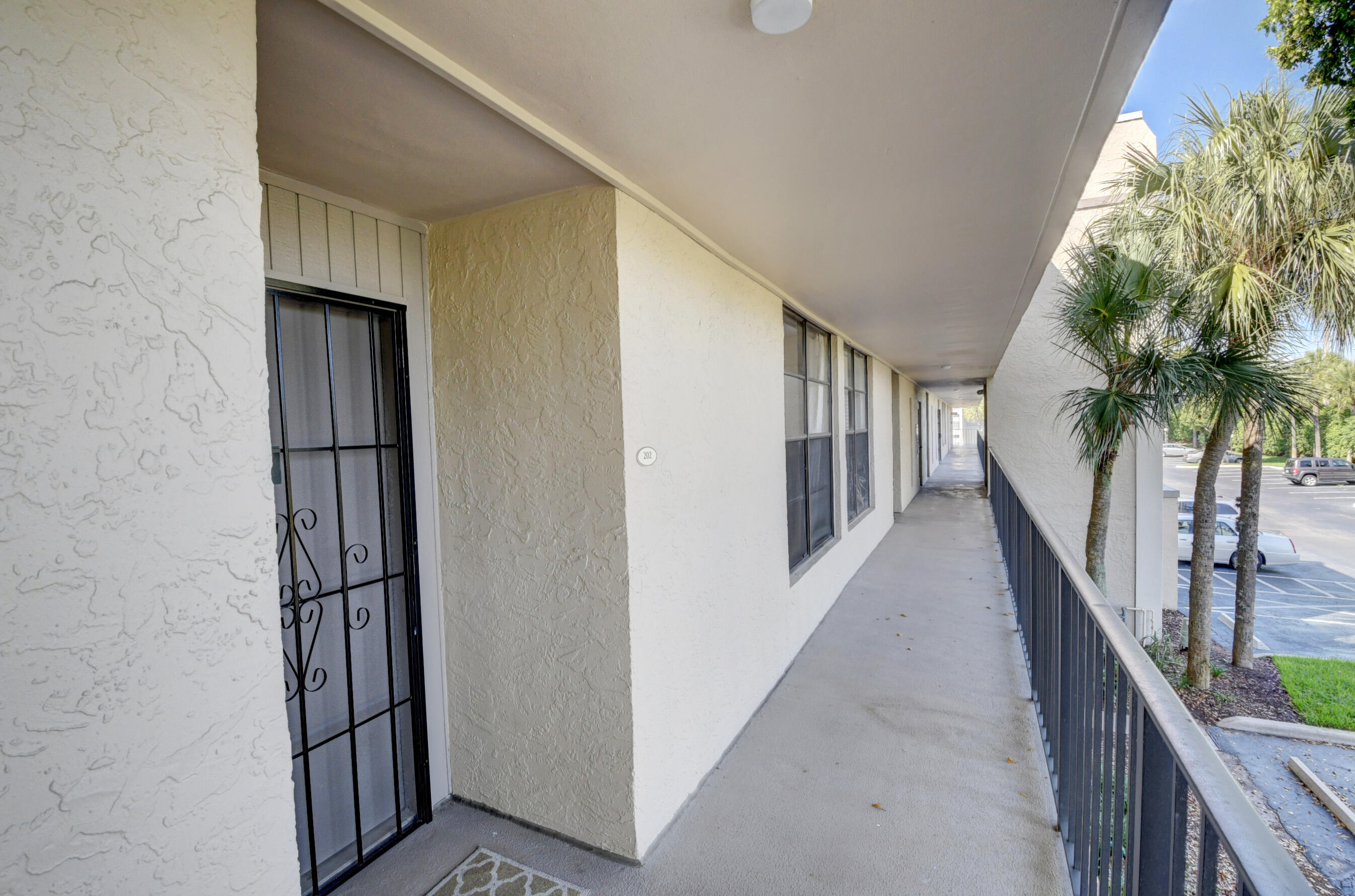 16 Royal Palm Way, Unit 202 Boca Raton, FL 33432 - Photo 3 of 54 a view of entryway with wooden floor and stairs