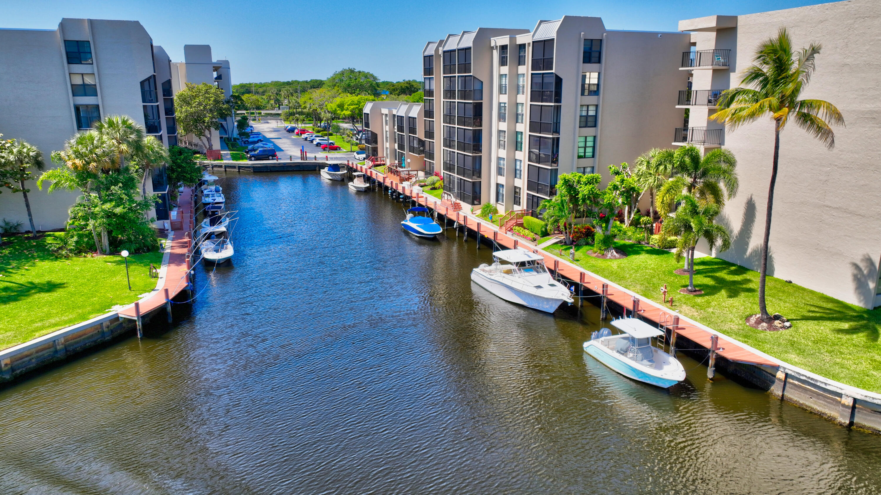16 Royal Palm Way, Unit 202 Boca Raton, FL 33432 - Photo 46 of 54 an aerial view of a house with a swimming pool patio and lake view