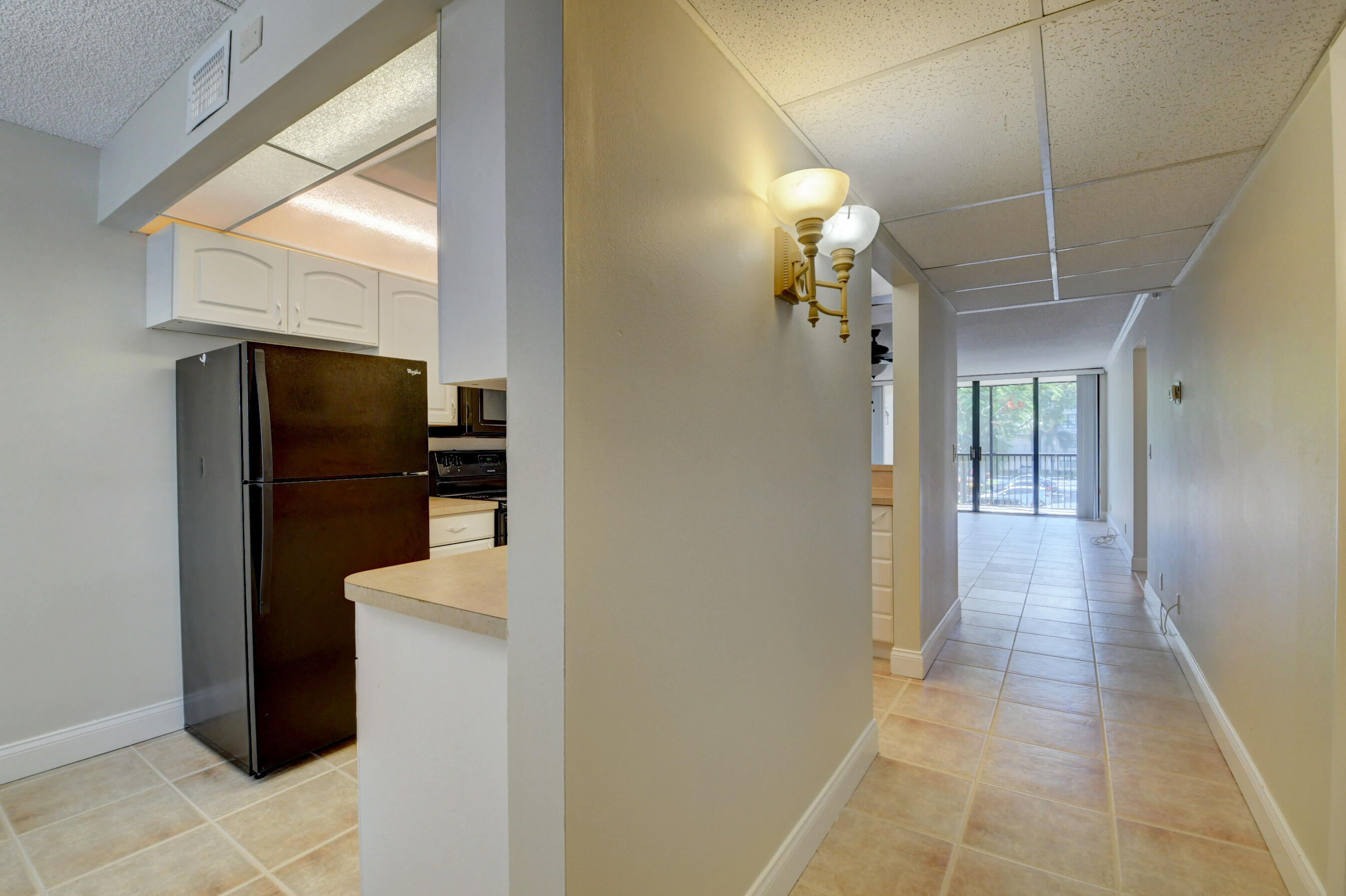 16 Royal Palm Way, Unit 202 Boca Raton, FL 33432 - Photo 6 of 54 a view of a hallway with wooden floor