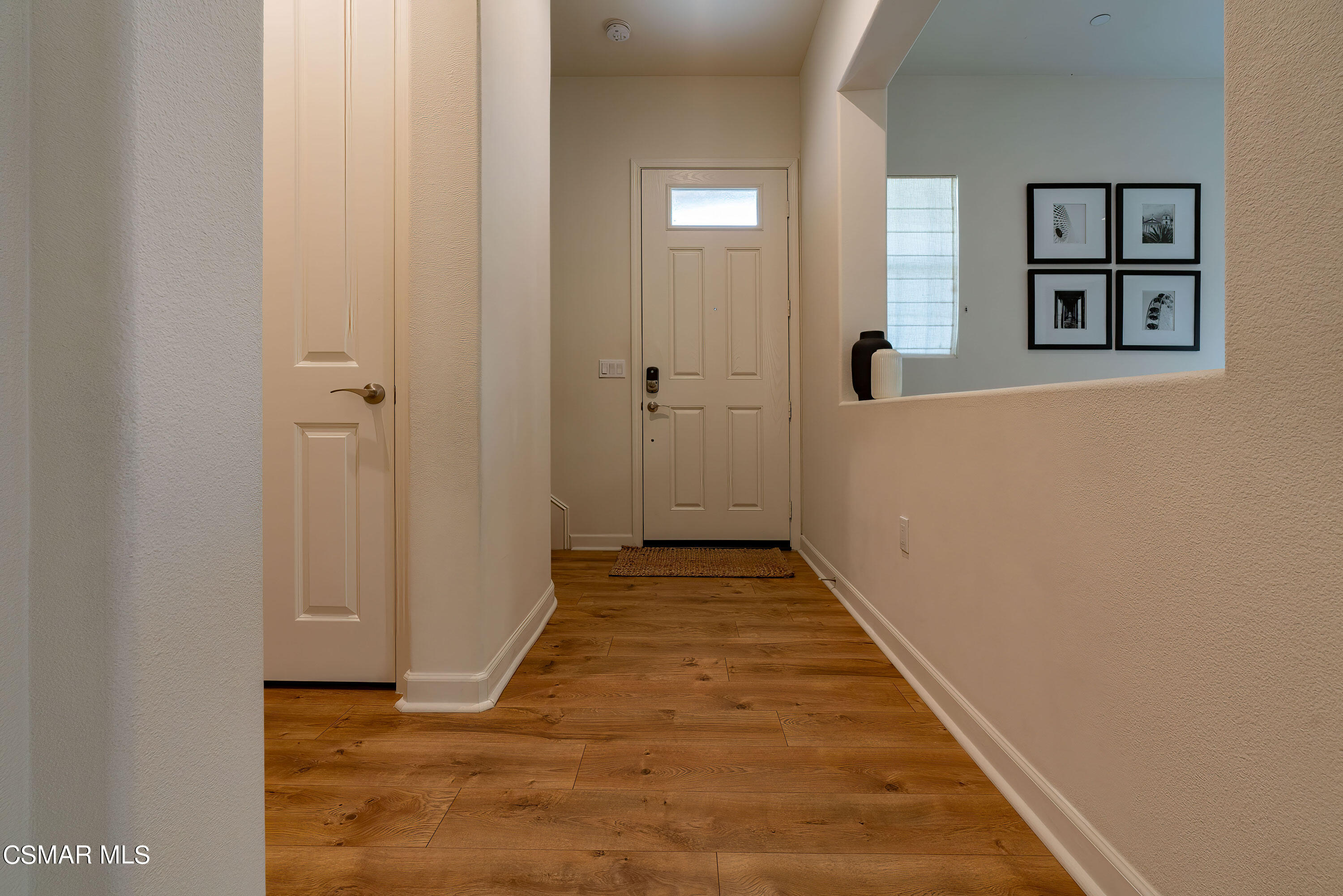 1614 Range Road Oxnard, CA 93036 - Photo 3 of 26 a view of a hallway with wooden floor and closet