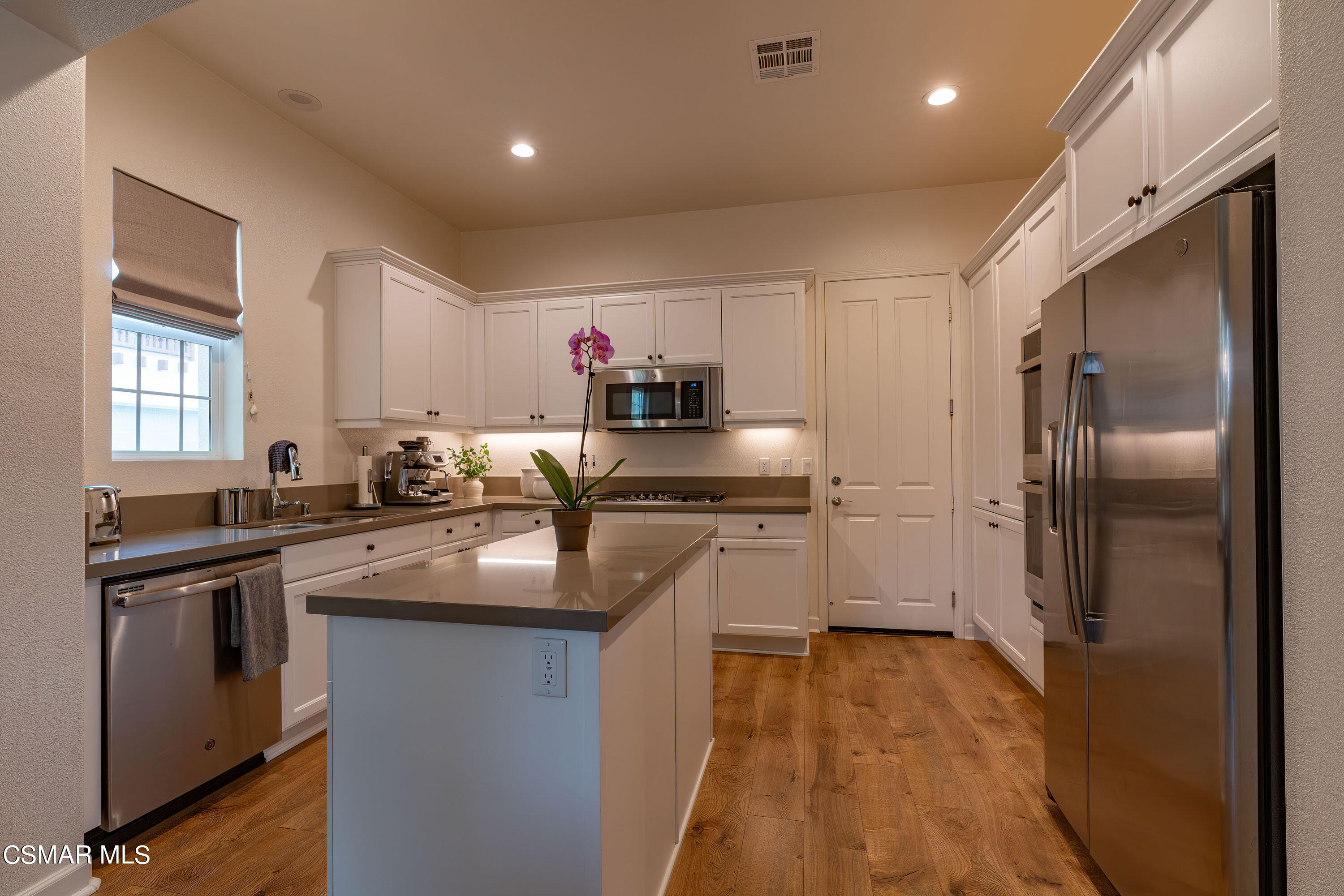 1614 Range Road Oxnard, CA 93036 - Photo 8 of 26 a kitchen with stainless steel appliances granite countertop a sink a stove and a refrigerator