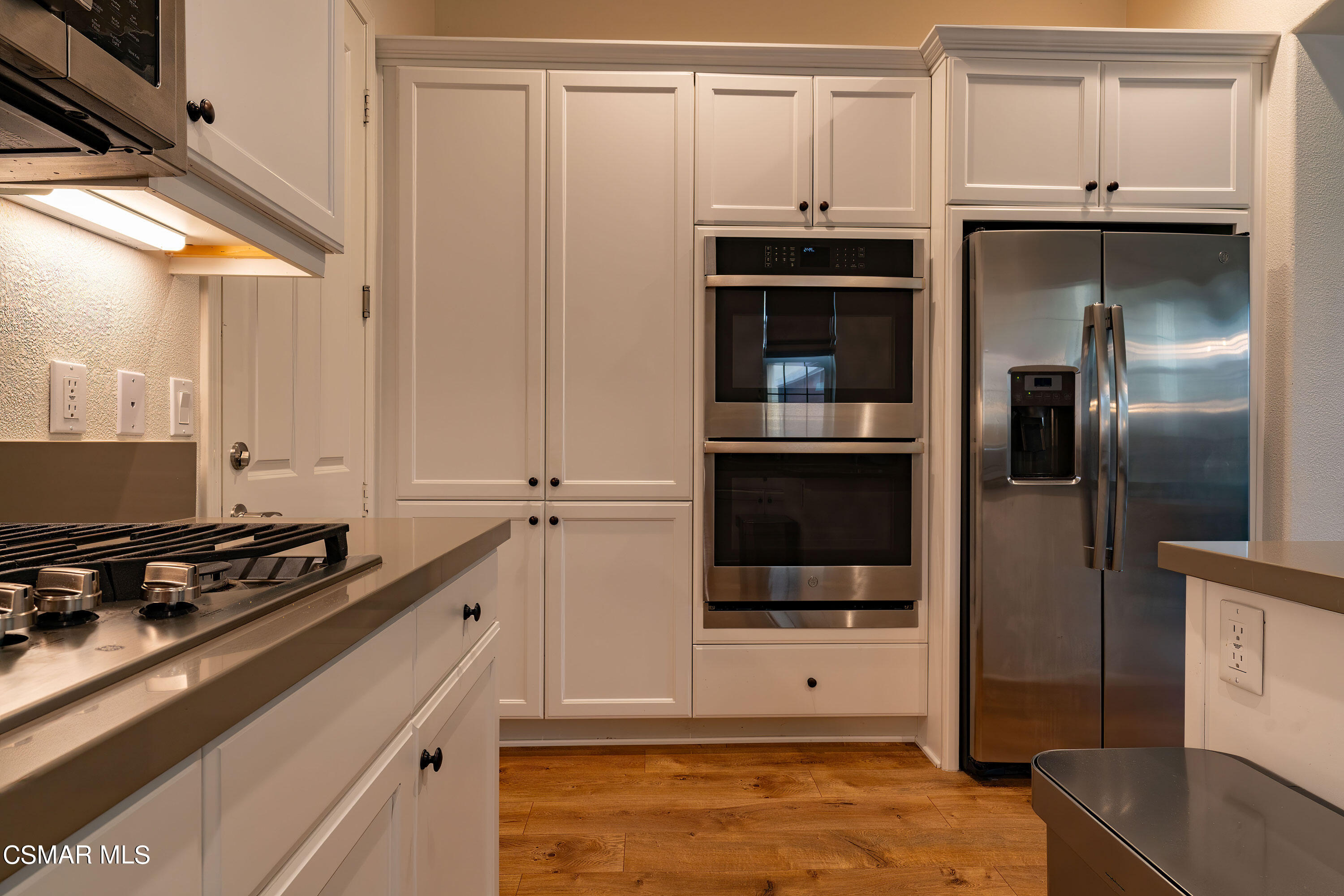 1614 Range Road Oxnard, CA 93036 - Photo 10 of 26 a kitchen with stainless steel appliances a refrigerator and a stove