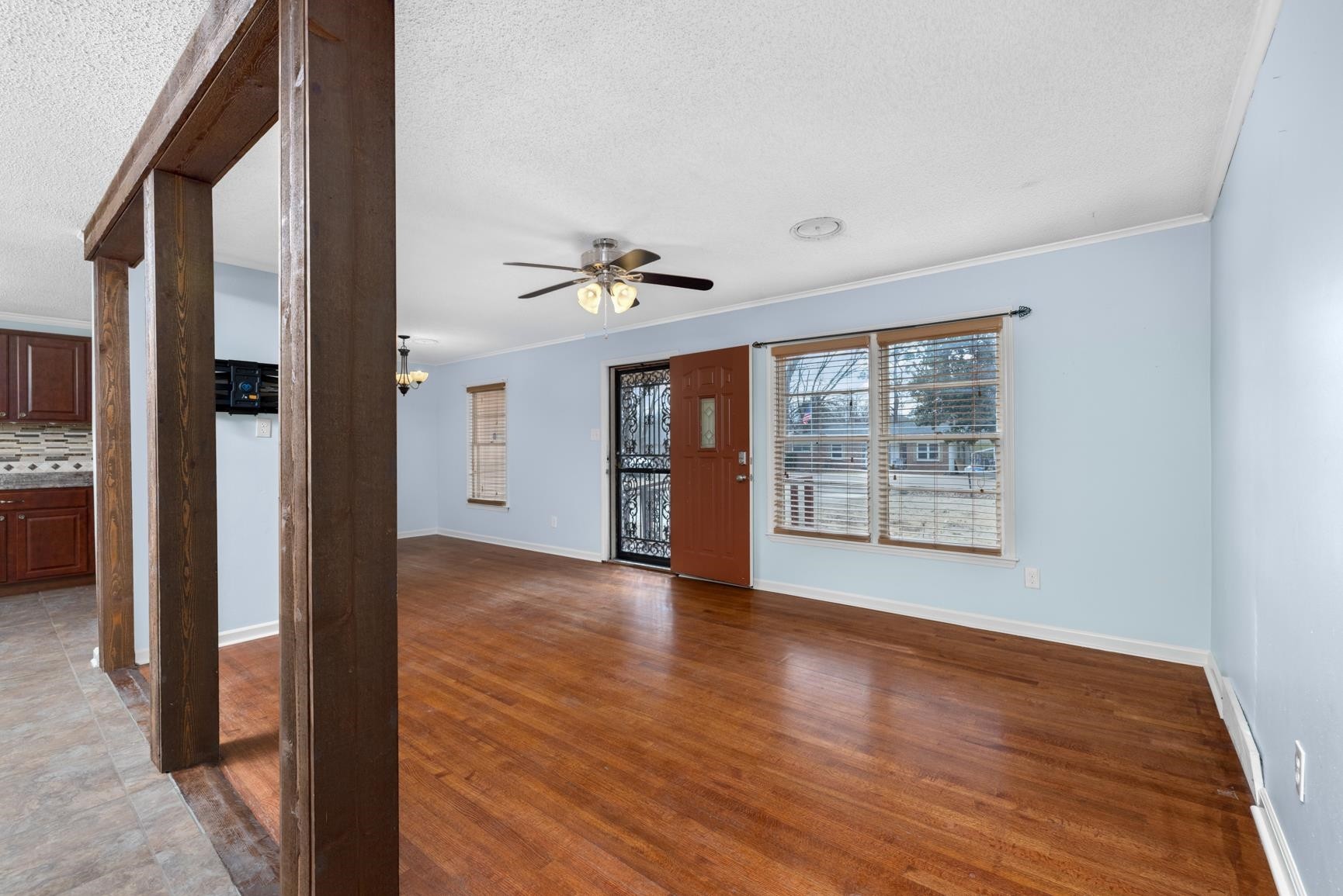 5364 Virgil Road Memphis, TN 38134 - Photo 12 of 32 a view of an empty room with wooden floor and a window