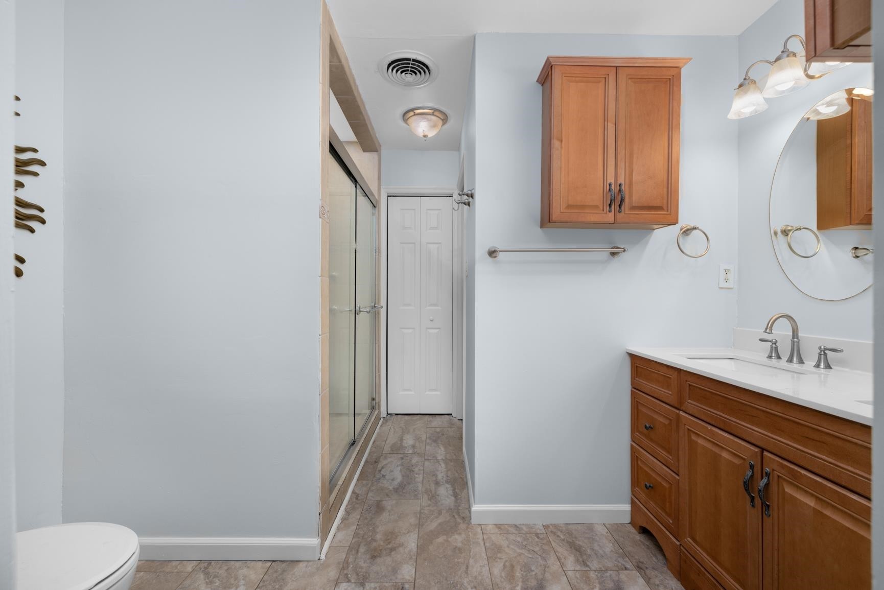5364 Virgil Road Memphis, TN 38134 - Photo 19 of 32 a bathroom with a granite countertop sink toilet and shower