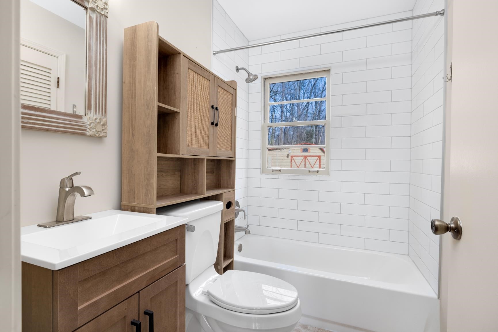 5364 Virgil Road Memphis, TN 38134 - Photo 21 of 32 a bathroom with a sink a toilet and shower