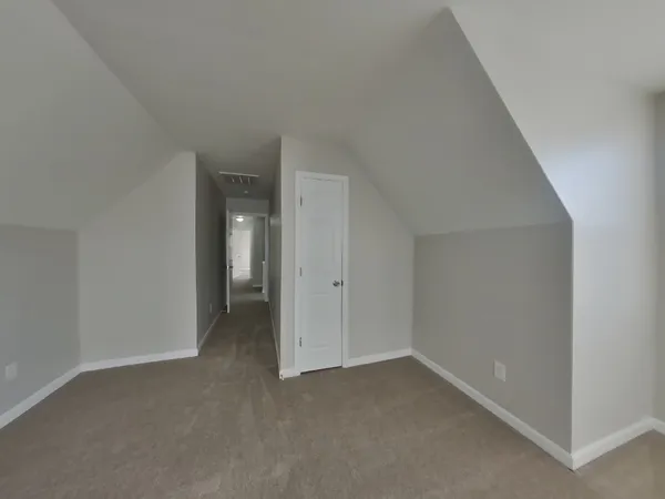 a view of an empty room and closet