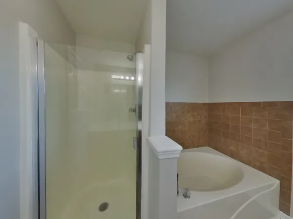 a bathroom with a toilet and a bathtub
