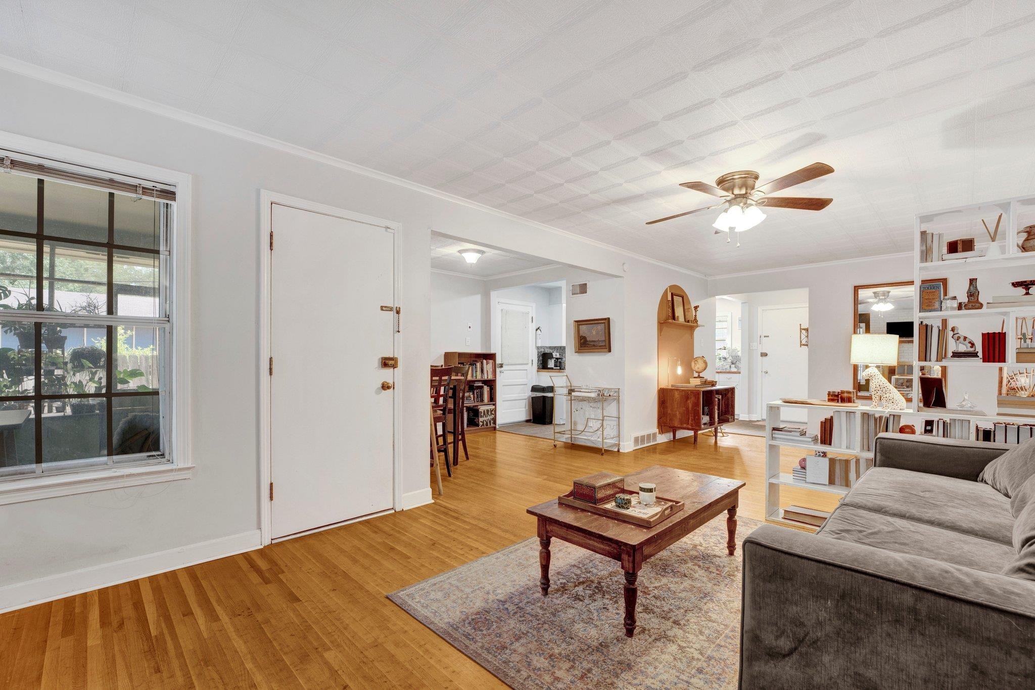 4500 East Dearing Road Memphis, TN 38117 - Photo 4 of 18 Living room featuring ceiling fan, ornamental molding, and light hardwood / wood-style floors