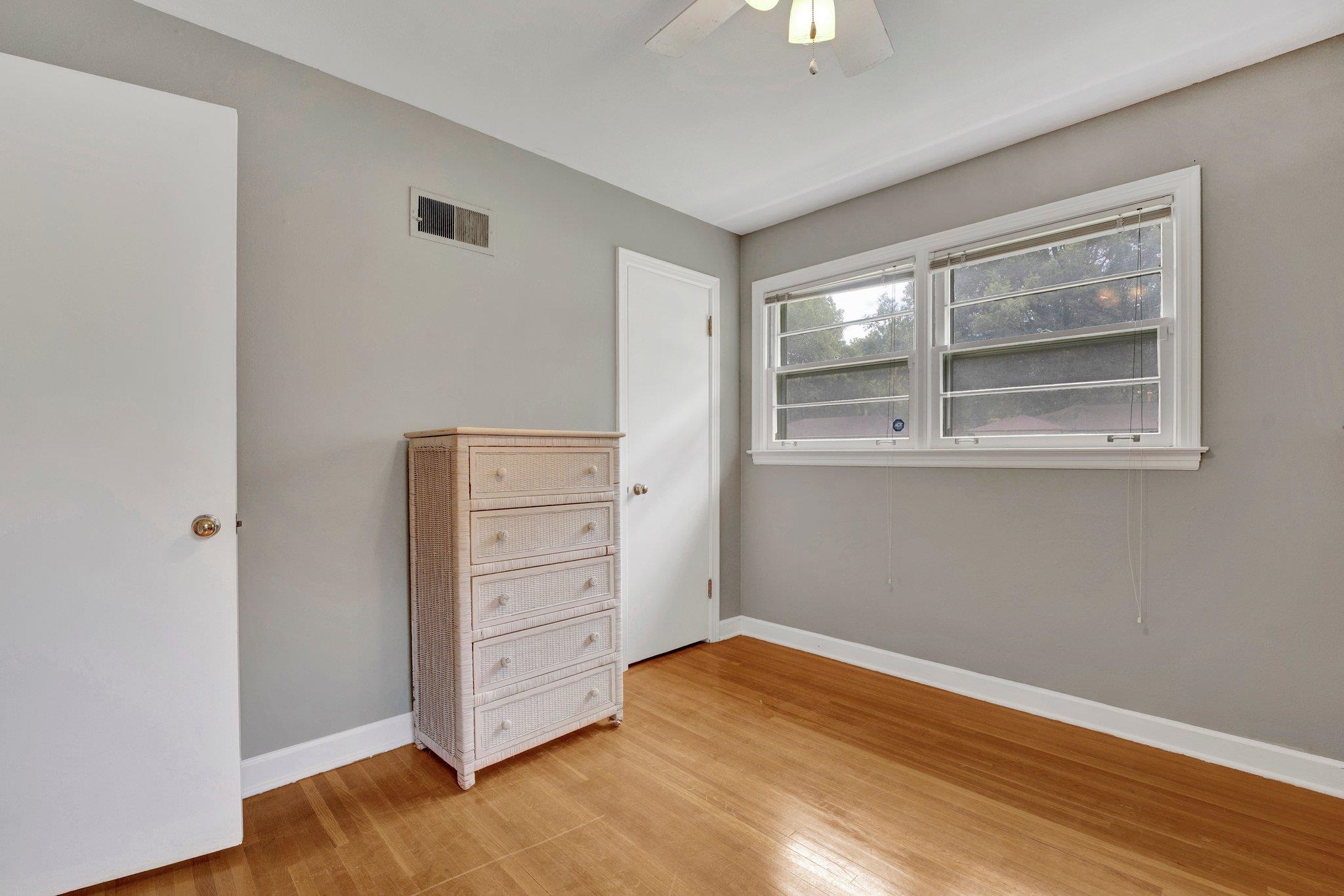 4500 East Dearing Road Memphis, TN 38117 - Photo 10 of 18 Unfurnished bedroom with ceiling fan and light hardwood / wood-style floors
