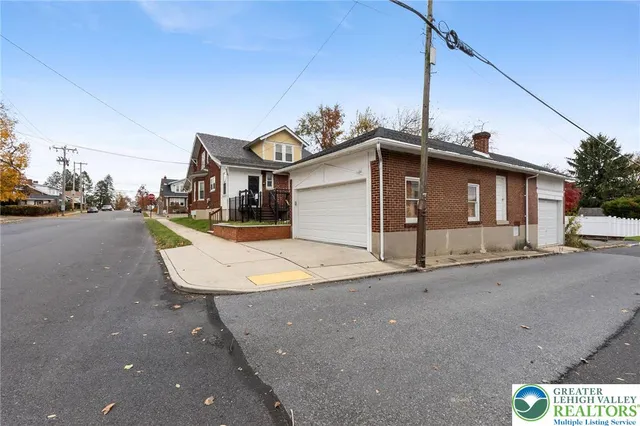a view of a house with a street