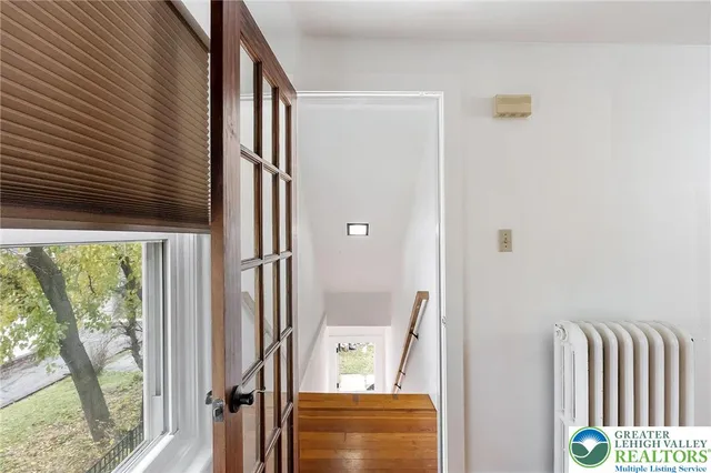 a front view of a house with a large window