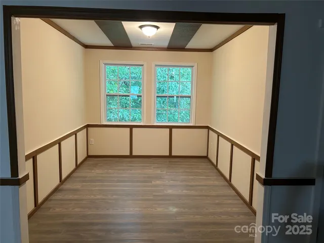 a bathroom with a granite countertop sink mirror and shower