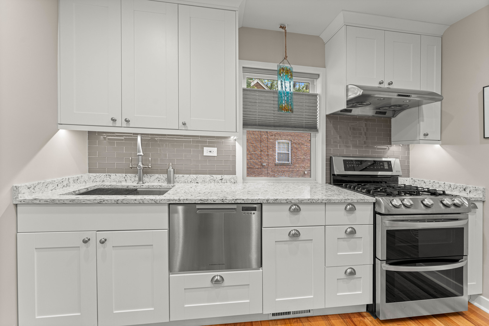 725 North County Line Road Hinsdale, IL 60521 - Photo 4 of 34 a kitchen with granite countertop a stove and a sink