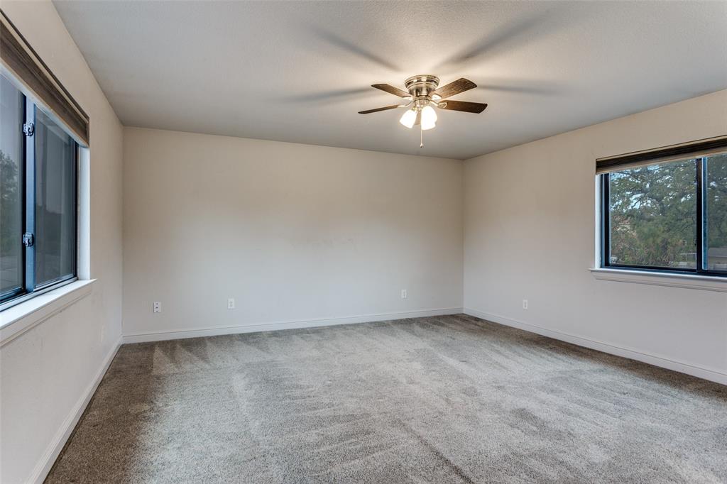 950 Turner Way Mansfield, TX 76063 - Photo 12 of 29 an empty room with windows and chandelier fan