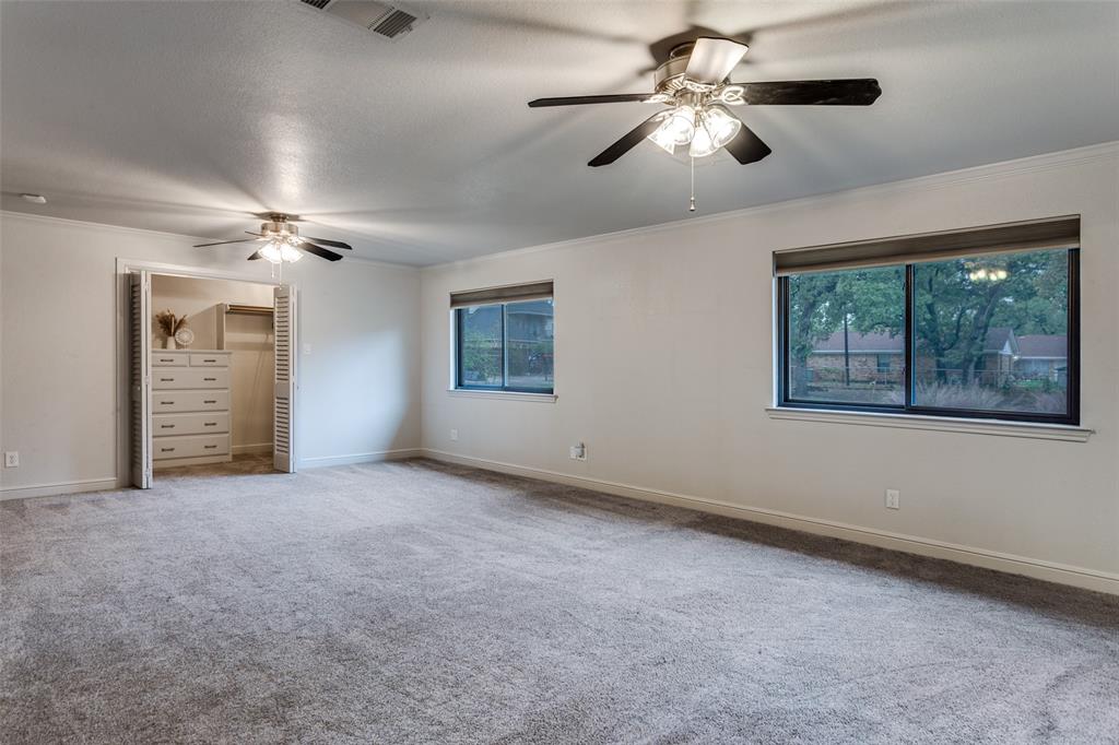 950 Turner Way Mansfield, TX 76063 - Photo 20 of 29 an empty room with windows and ceiling fan