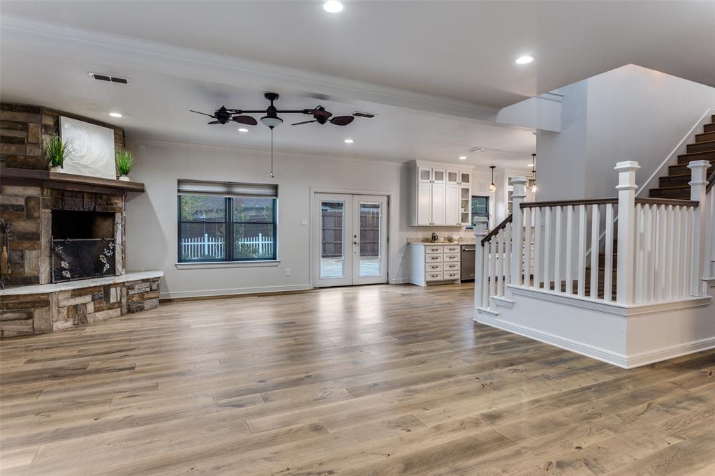 950 Turner Way Mansfield, TX 76063 - Photo 8 of 29 an empty room with wooden floor fireplace and windows