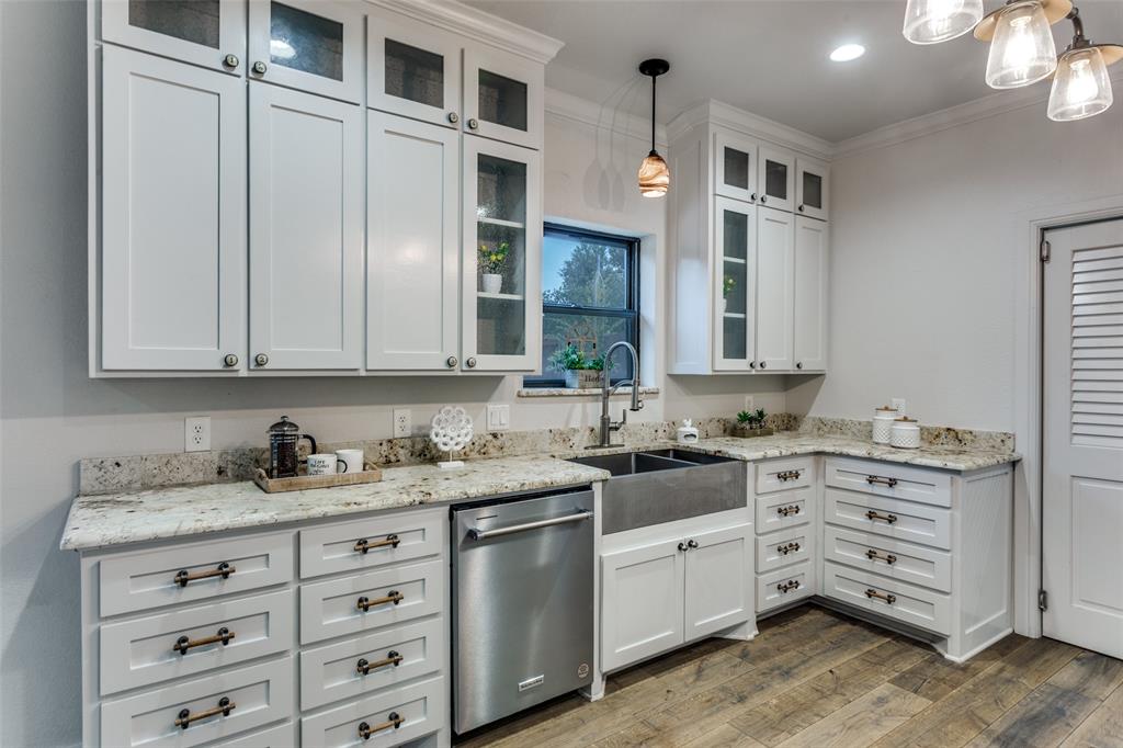 950 Turner Way Mansfield, TX 76063 - Photo 10 of 29 a kitchen with granite countertop white cabinets and sink