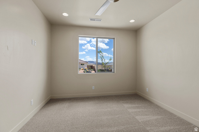 2955 East Rimrunner Drive St. George, UT 84790 - Photo 27 of 35 Carpeted interior room featuring a large window, recessed lighting, and a ceiling fan