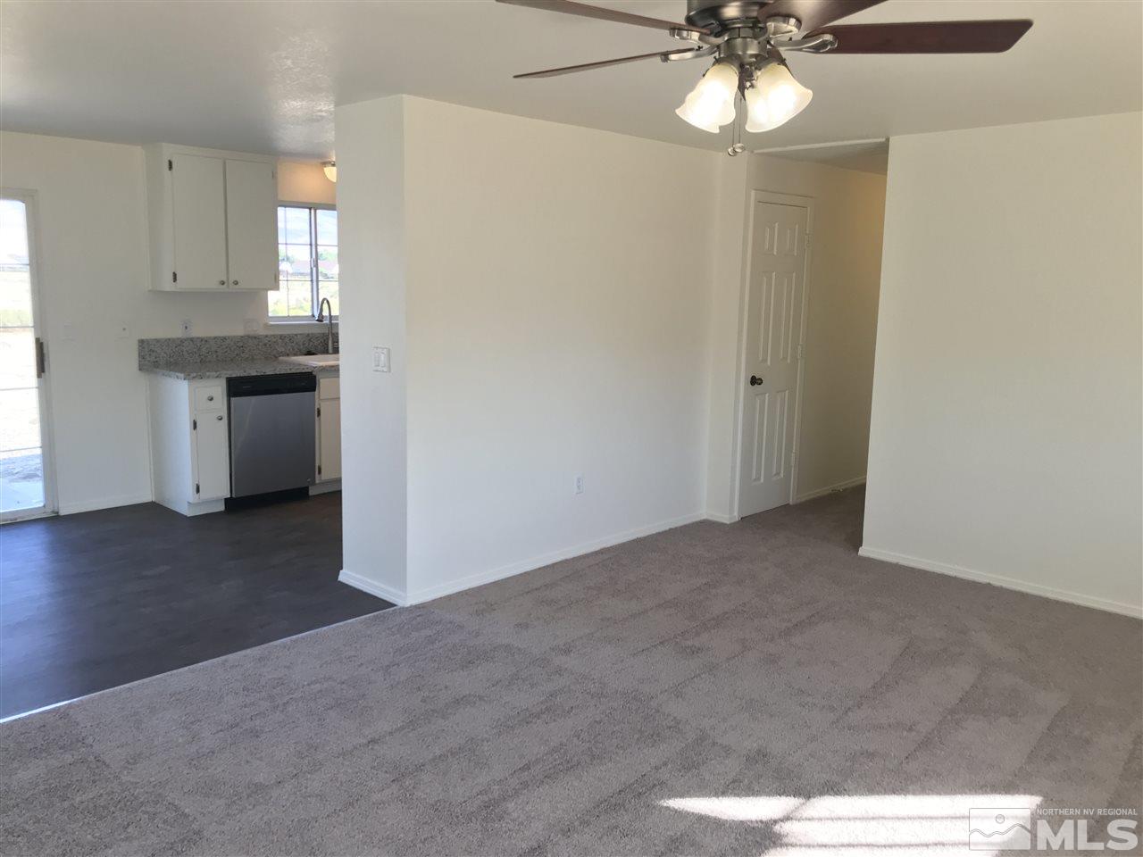 118 Empire Road Dayton, NV 89403 - Photo 4 of 16 a view of a kitchen with a sink and cabinet area