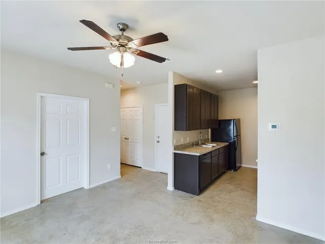 a view of kitchen with cabinets and stainless steel appliances