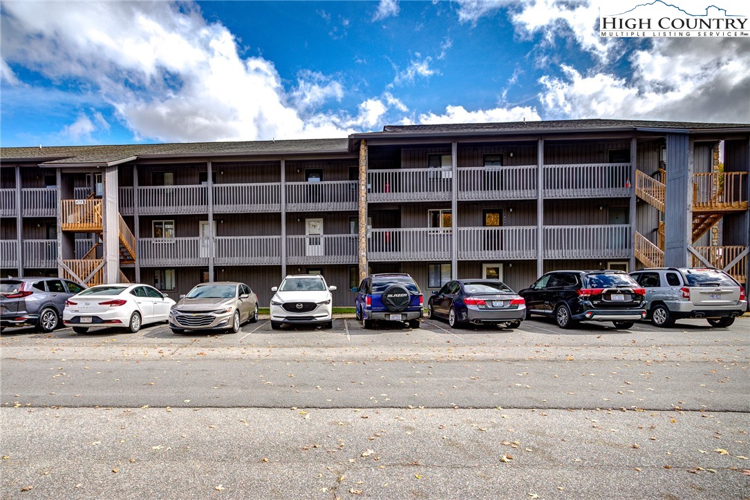 160 Zeb Street, Unit C104 Boone, NC 28607 - Photo 13 of 21 a view of a cars parked in front of a building