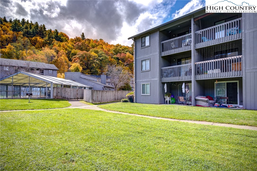 160 Zeb Street, Unit C104 Boone, NC 28607 - Photo 15 of 21 a view of an house with swimming pool and a yard