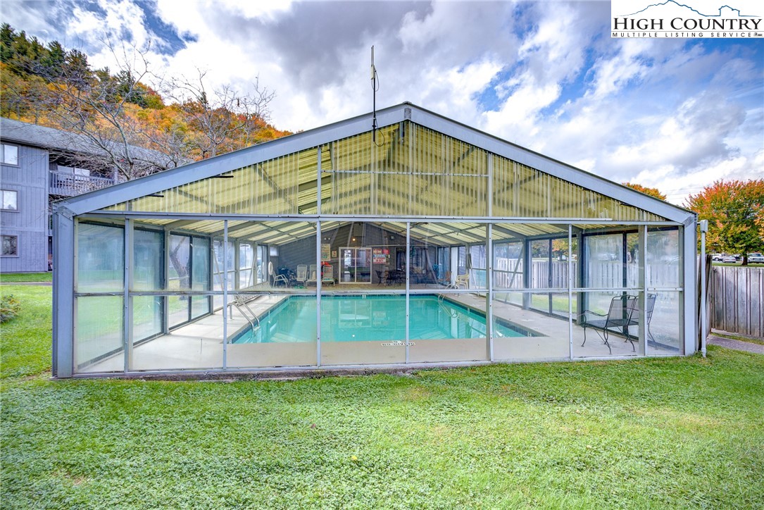 160 Zeb Street, Unit C104 Boone, NC 28607 - Photo 18 of 21 a view of a house with a backyard