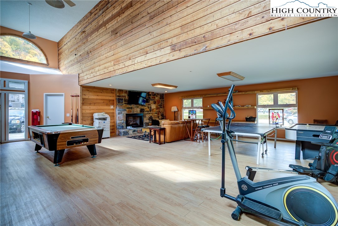160 Zeb Street, Unit C104 Boone, NC 28607 - Photo 20 of 21 a room with lots of furniture and gym equipment