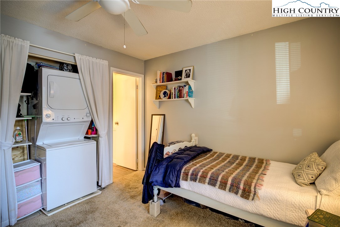 160 Zeb Street, Unit C104 Boone, NC 28607 - Photo 7 of 21 a bedroom with a bed and a couch