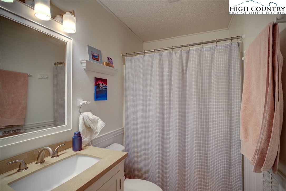 160 Zeb Street, Unit C104 Boone, NC 28607 - Photo 8 of 21 a bathroom with a sink and a mirror