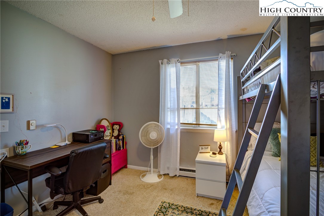 160 Zeb Street, Unit C104 Boone, NC 28607 - Photo 10 of 21 a view of a workspace with furniture and a window