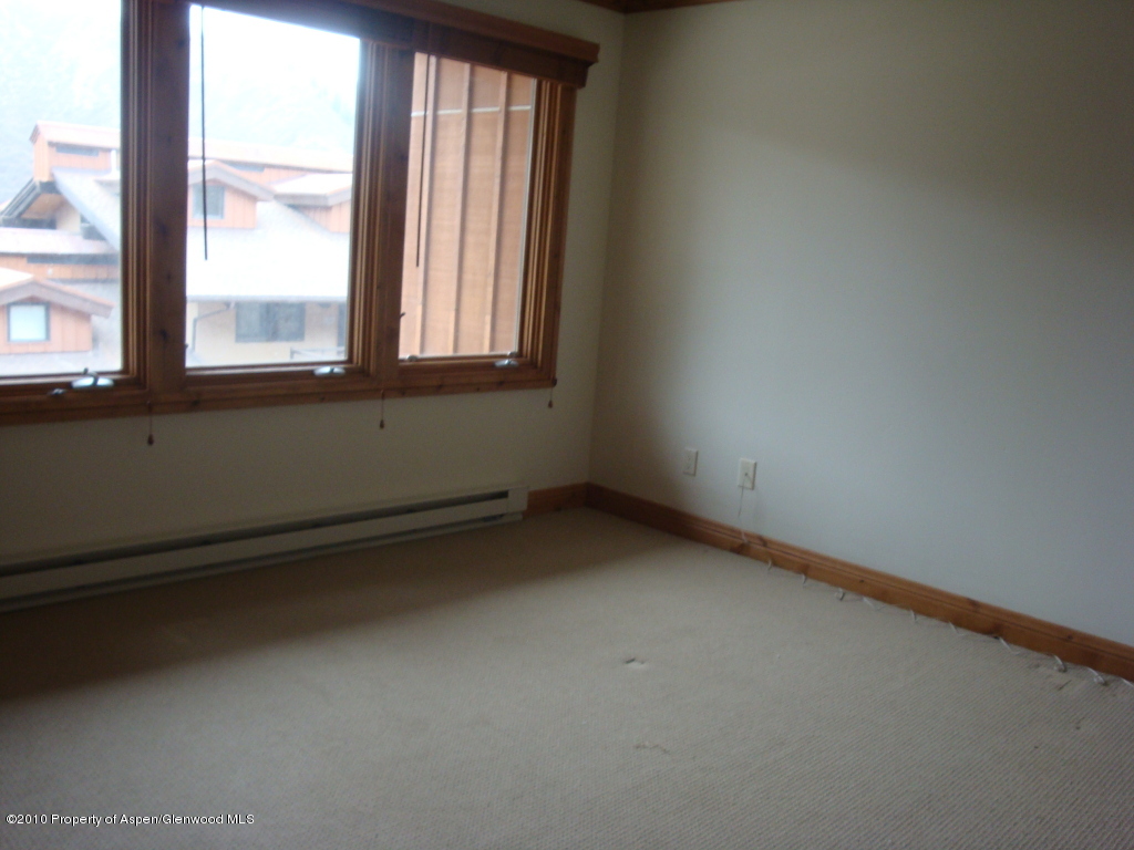 400 Wood Road, Unit 2203 Snowmass Village, CO 81615 - Photo 3 of 8 a view of an empty room with a window