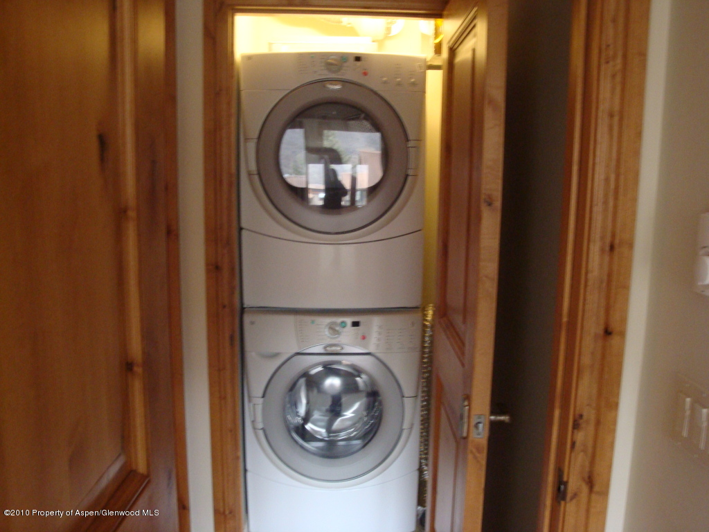 400 Wood Road, Unit 2203 Snowmass Village, CO 81615 - Photo 5 of 8 a utility room with dryer and washer