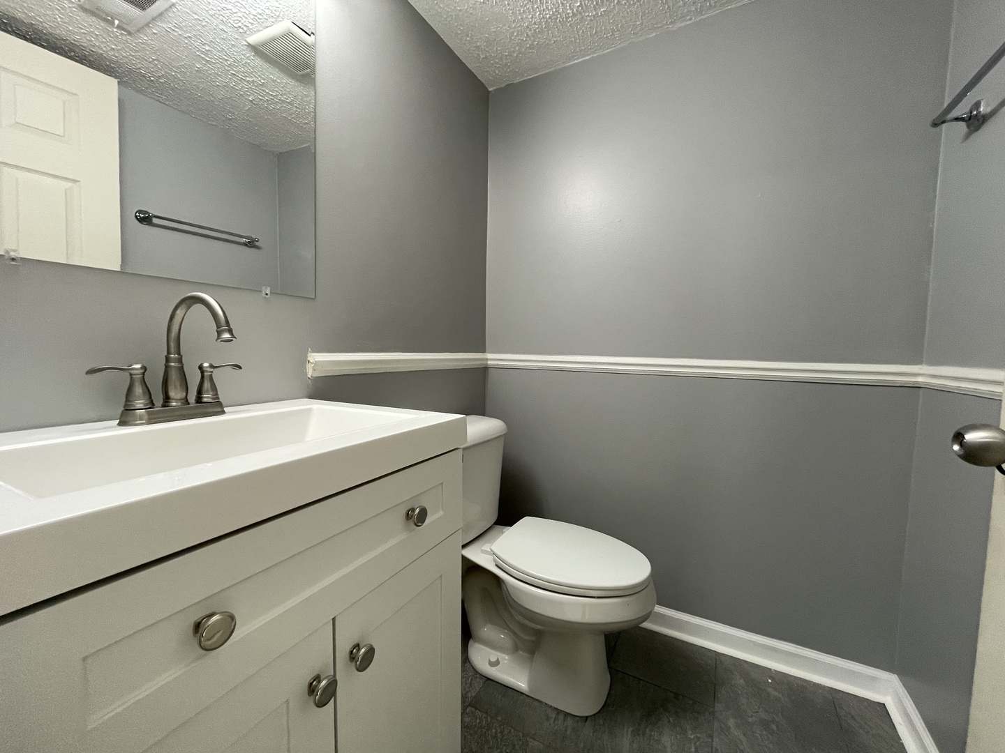 1105 Sandpiper Court Bartlett, IL 60103 - Photo 9 of 28 a bathroom with a sink a toilet and vanity