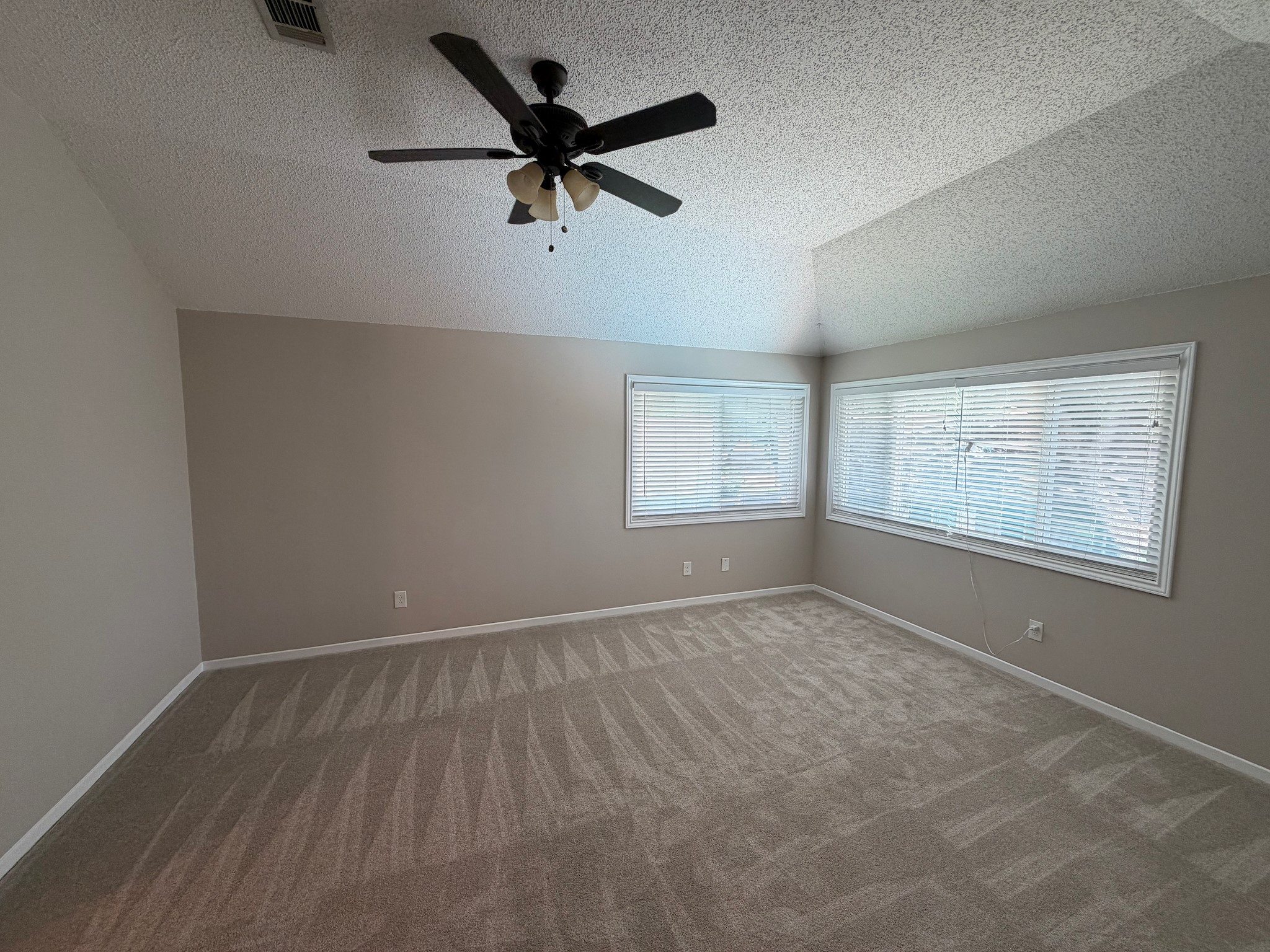 2326 Streamcrest Lane Sugar Land, TX 77479 - Photo 24 of 42 Primary bedroom with high ceiling and windows overlooking pool.