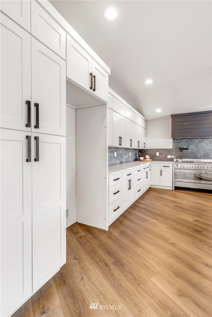 3222 Creswell Road Snohomish, WA 98290 - Photo 16 of 36 a kitchen with stainless steel appliances a refrigerator sink and cabinets