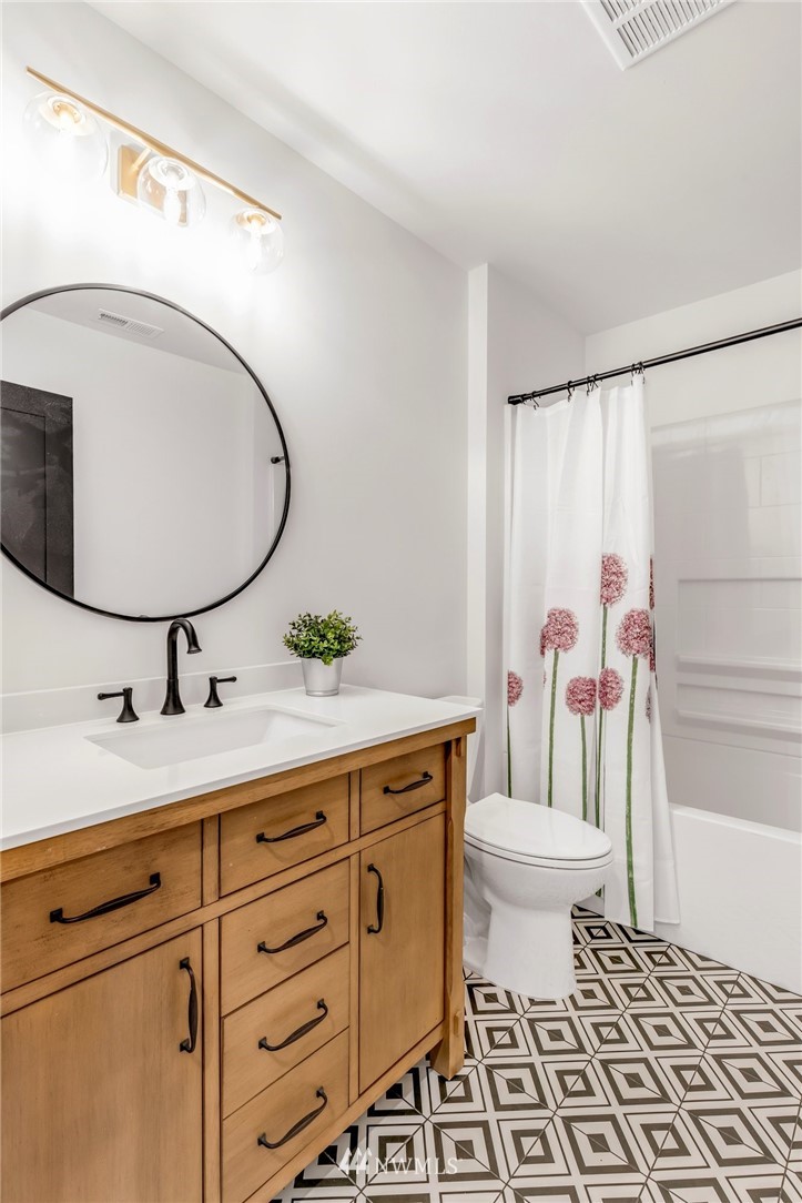 3222 Creswell Road Snohomish, WA 98290 - Photo 25 of 36 a bathroom with a sink a toilet and a mirror