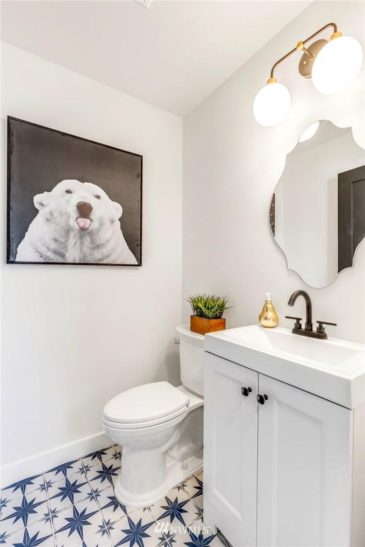 3222 Creswell Road Snohomish, WA 98290 - Photo 27 of 36 a bathroom with a toilet sink vanity and mirror