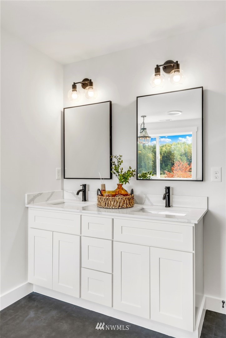 3222 Creswell Road Snohomish, WA 98290 - Photo 31 of 36 a bathroom with a sink and a mirror