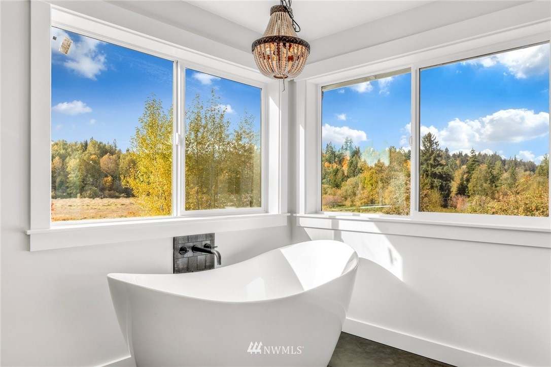 3222 Creswell Road Snohomish, WA 98290 - Photo 32 of 36 a white bath tub sitting in front of a window