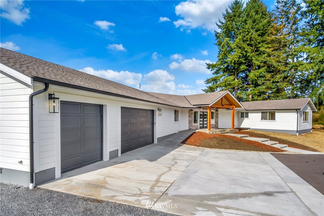 3222 Creswell Road Snohomish, WA 98290 - Photo 33 of 36 a front view of a house with a yard and garage