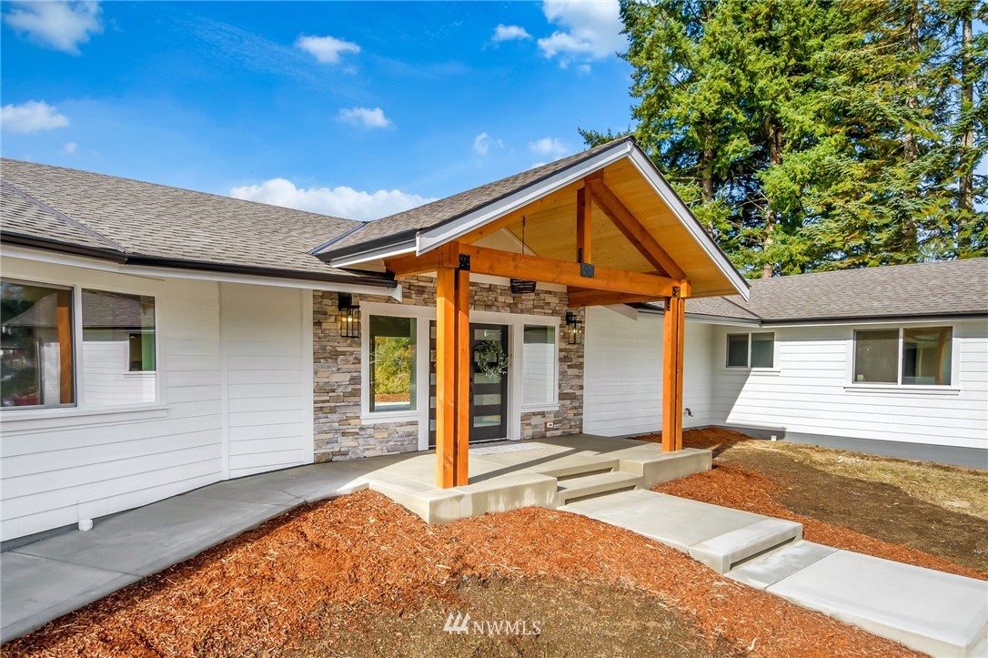3222 Creswell Road Snohomish, WA 98290 - Photo 4 of 36 a front view of a house with a yard and garage