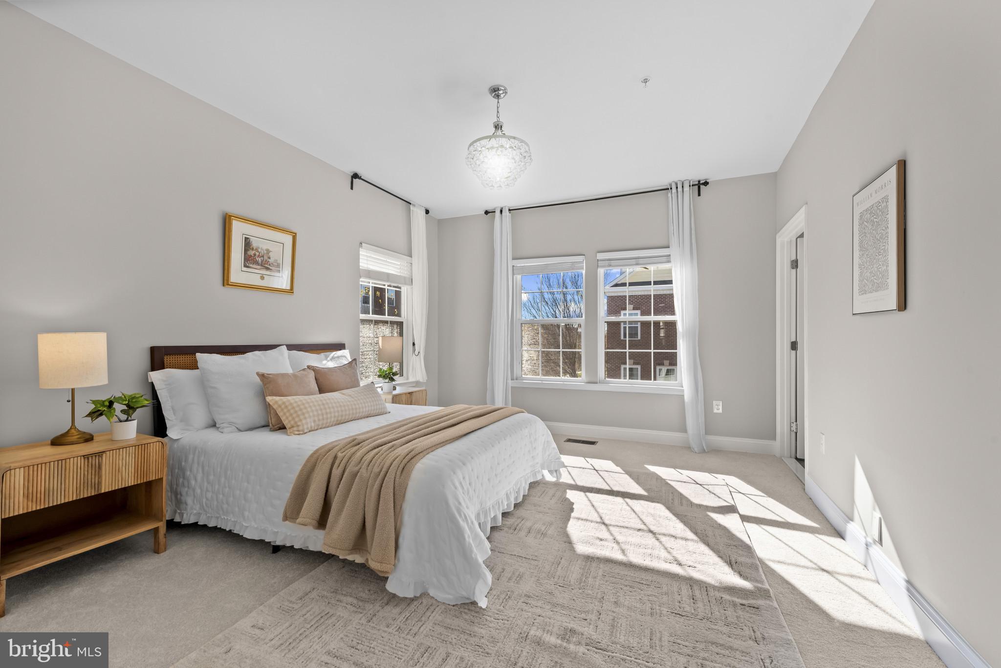 5948 Logans Way Ellicott City, MD 21043 - Photo 25 of 44 a spacious bedroom with a bed and a window